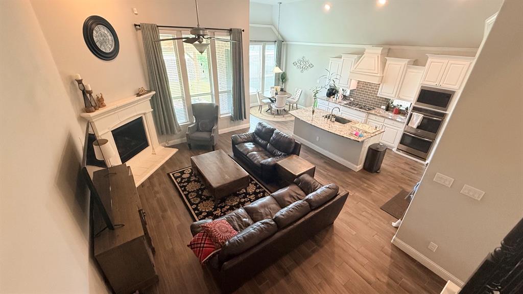 337 Prairie Ridge Lane Lewisville, TX 75056 - Photo 10 of 28 a living room with furniture and a flat screen tv