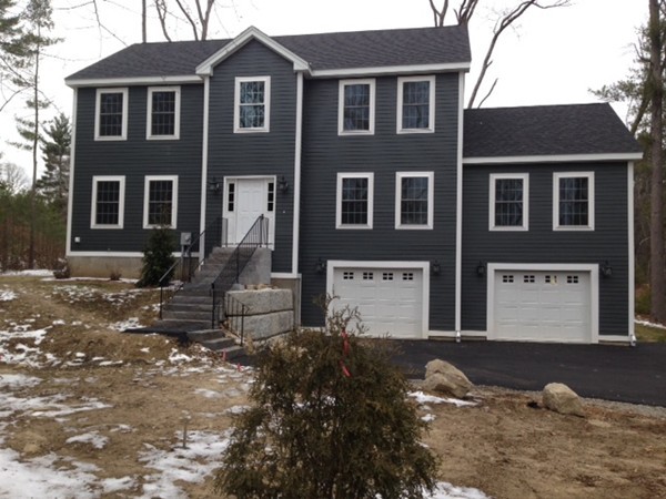 2 Cold Spring Brook Road Hopkinton, MA 01748 - Photo 1 of 20 a front view of a house with a yard