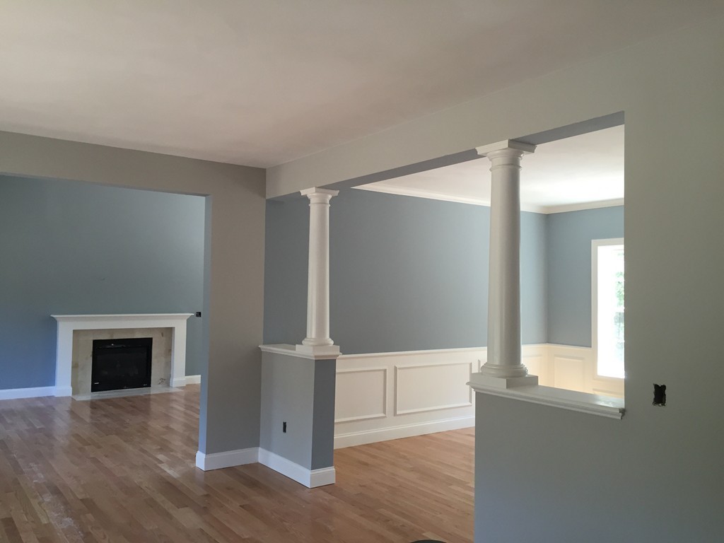 2 Cold Spring Brook Road Hopkinton, MA 01748 - Photo 11 of 20 an empty room with wooden floor and fireplace