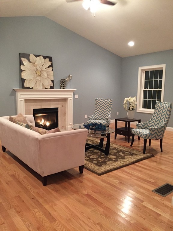 2 Cold Spring Brook Road Hopkinton, MA 01748 - Photo 15 of 20 a living room with furniture and a fireplace