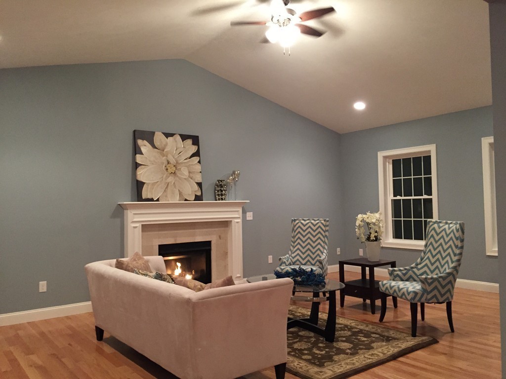 2 Cold Spring Brook Road Hopkinton, MA 01748 - Photo 16 of 20 a living room with furniture and a fireplace