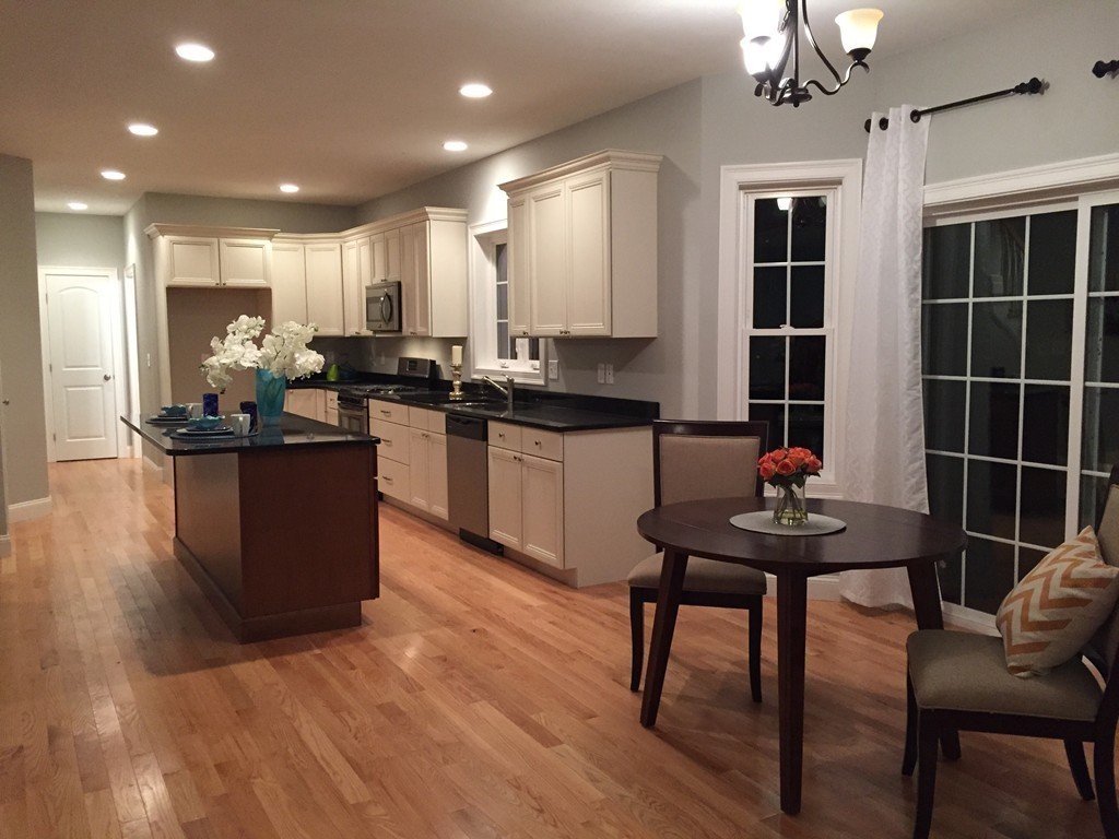 2 Cold Spring Brook Road Hopkinton, MA 01748 - Photo 6 of 20 a kitchen with stainless steel appliances kitchen island granite countertop a sink table and chairs