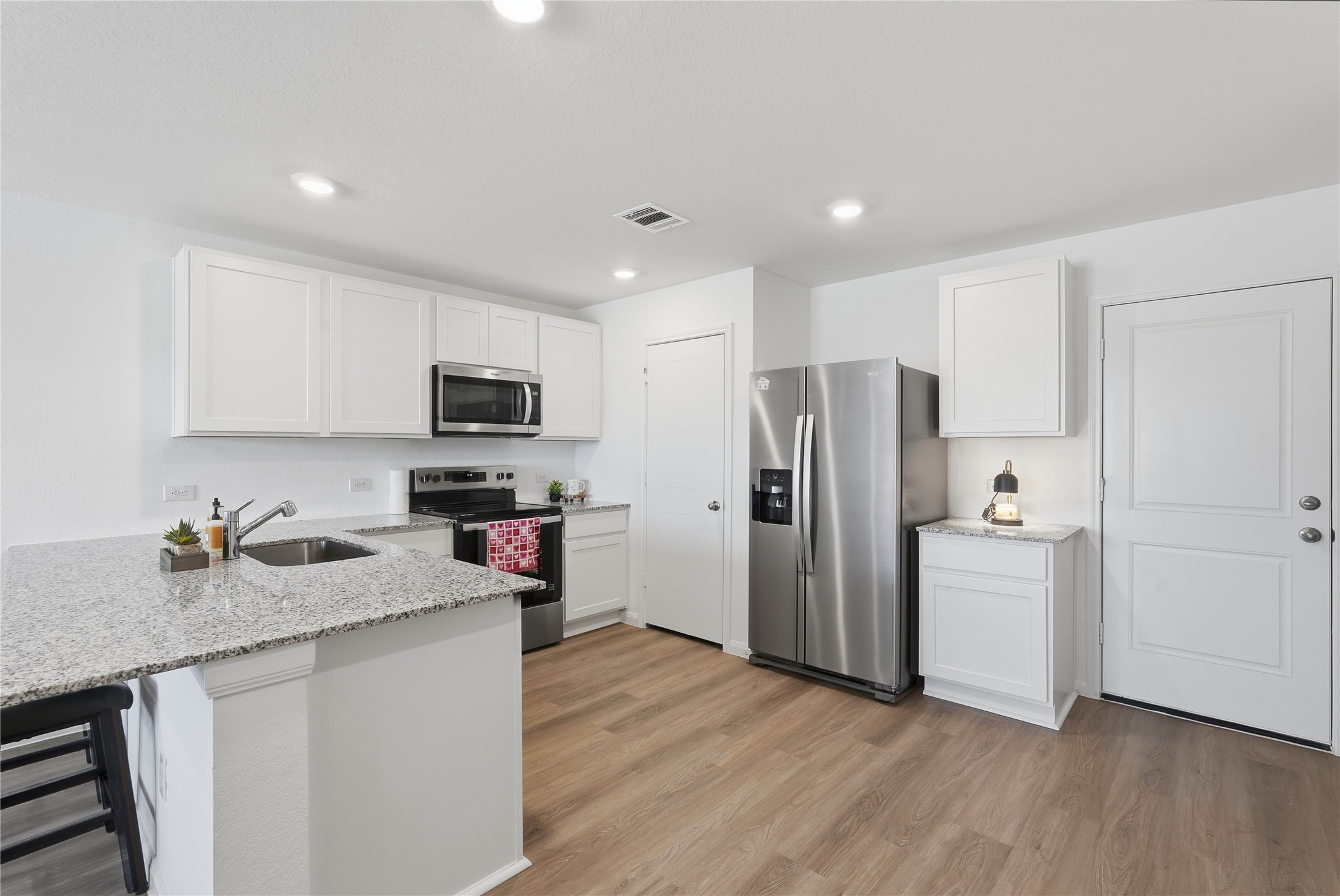 12366 Sword Point Court Willis, TX 77378 - Photo 9 of 21 Kitchen open to living