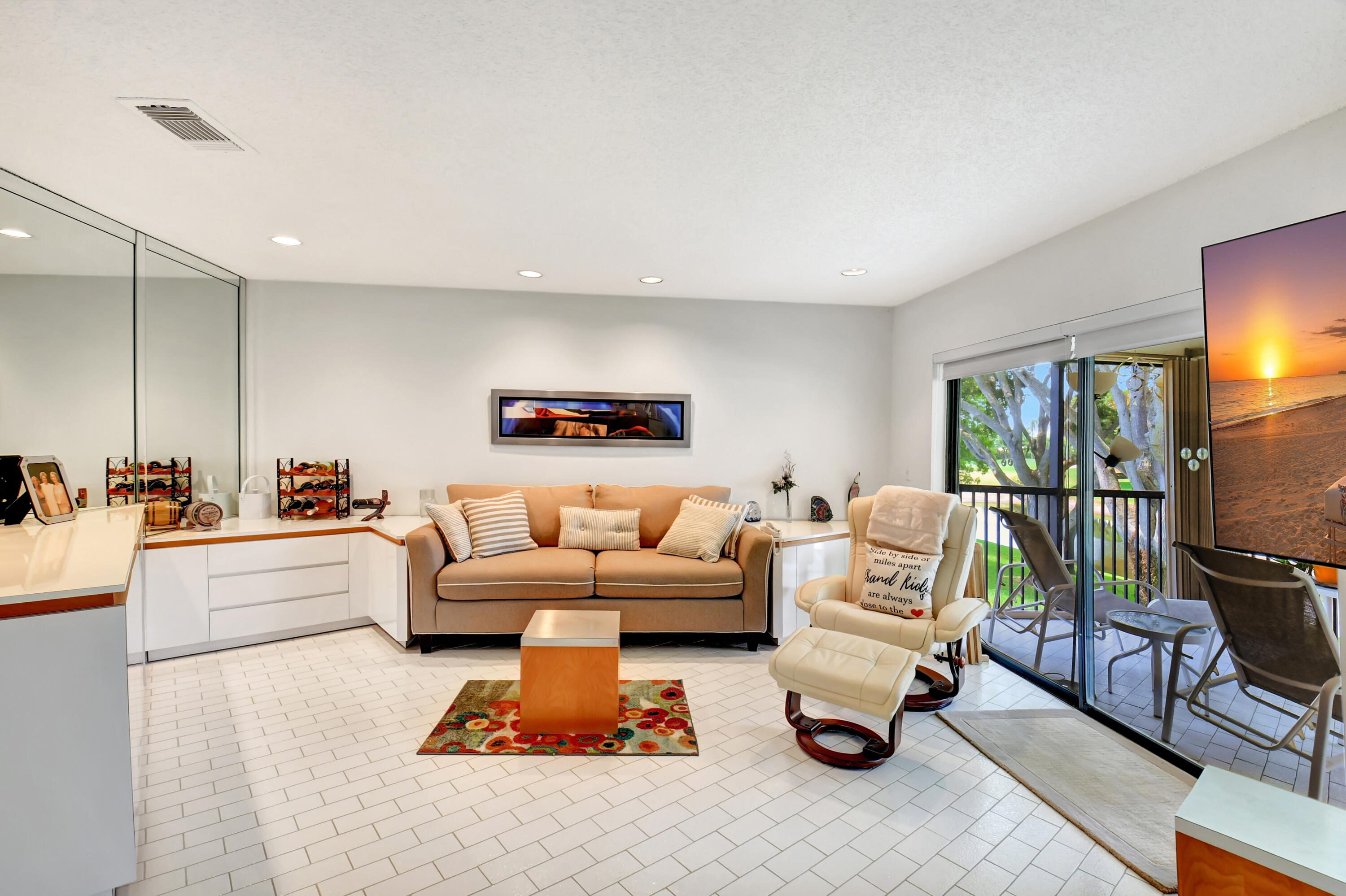 15 Stratford Drive, Unit B Boynton Beach, FL 33436 - Photo 18 of 84 a living room with furniture and a flat screen tv