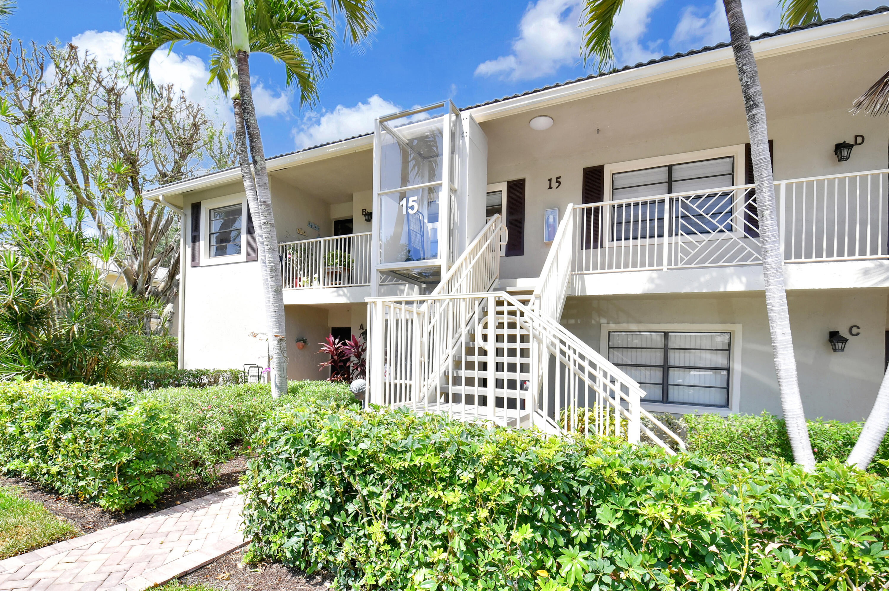 15 Stratford Drive, Unit B Boynton Beach, FL 33436 - Photo 2 of 84 front view of a house with a porch