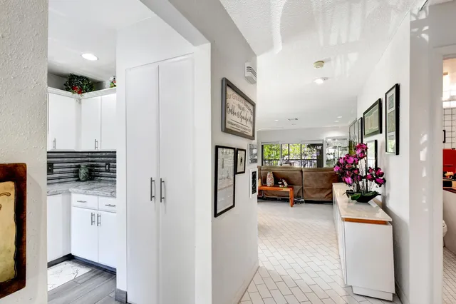 a kitchen with stainless steel appliances a sink and a refrigerator
