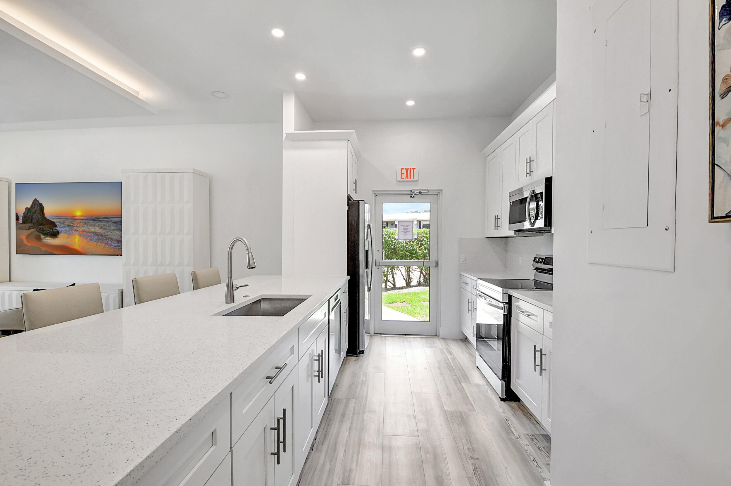 15 Stratford Drive, Unit B Boynton Beach, FL 33436 - Photo 52 of 84 a spacious bathroom with a granite countertop sink a toilet a mirror and shower