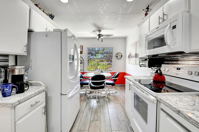 a dining room with furniture and a chandelier