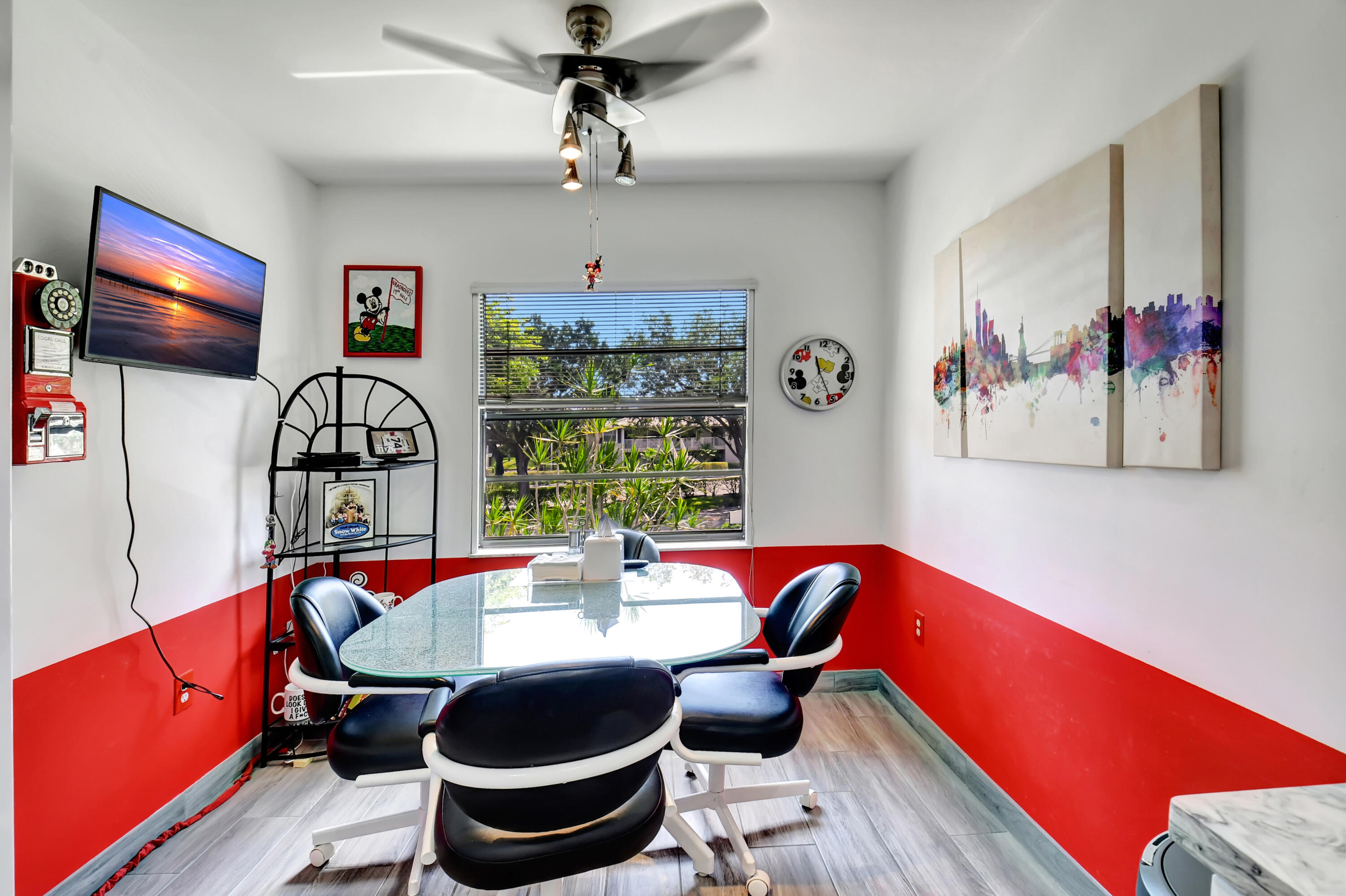 15 Stratford Drive, Unit B Boynton Beach, FL 33436 - Photo 8 of 84 a view of a dining room with furniture a chandelier and wooden floor