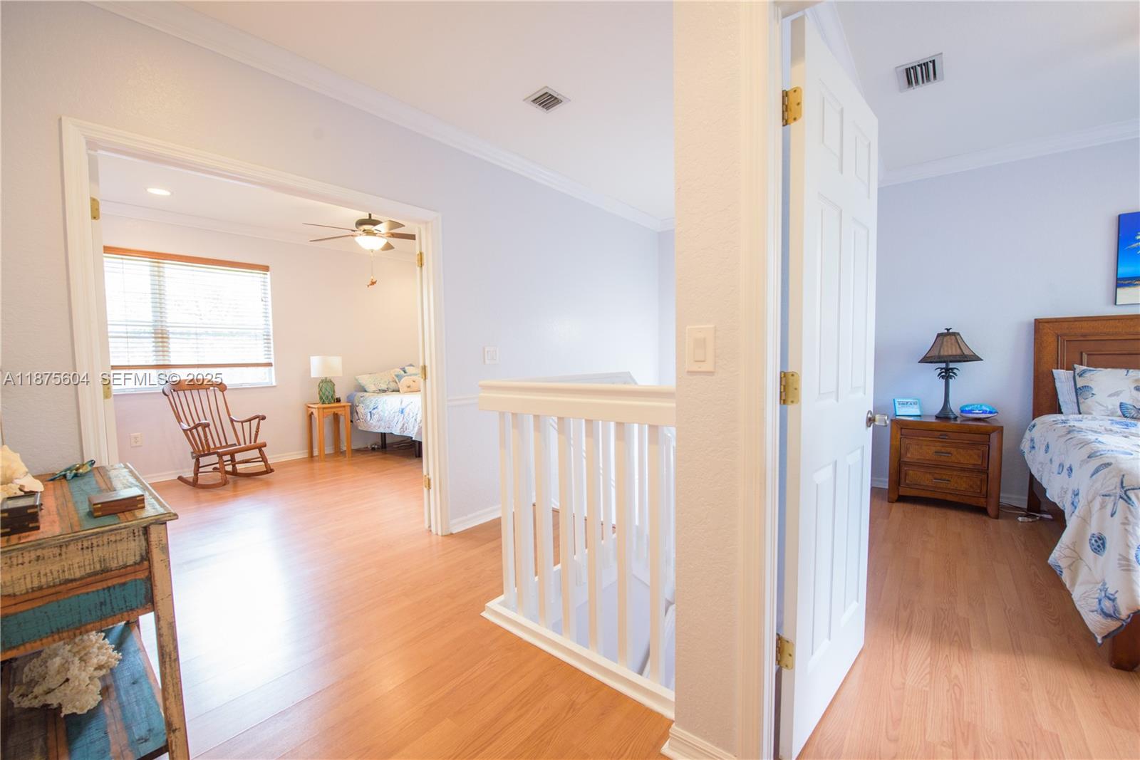 1316 Southeast 18th Terrace Homestead, FL 33035 - Photo 11 of 29 a bedroom with furniture and a wooden floor