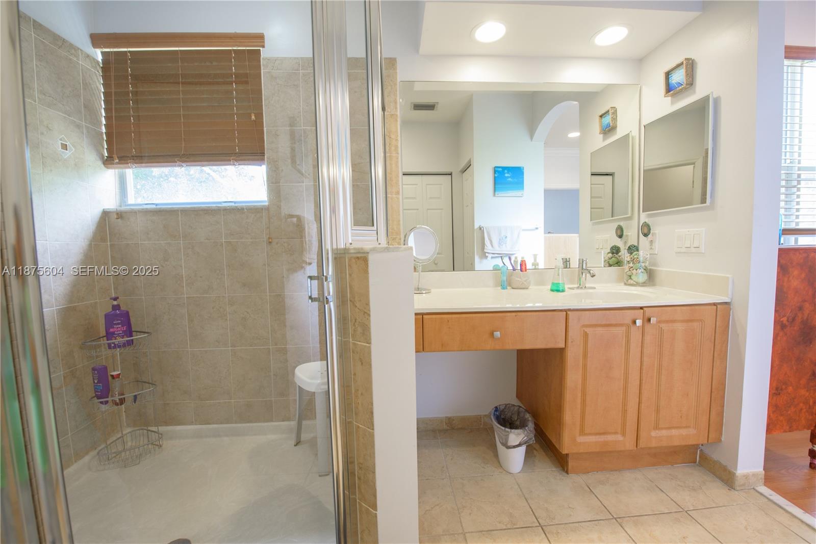 1316 Southeast 18th Terrace Homestead, FL 33035 - Photo 14 of 29 a bathroom with a sink and a mirror
