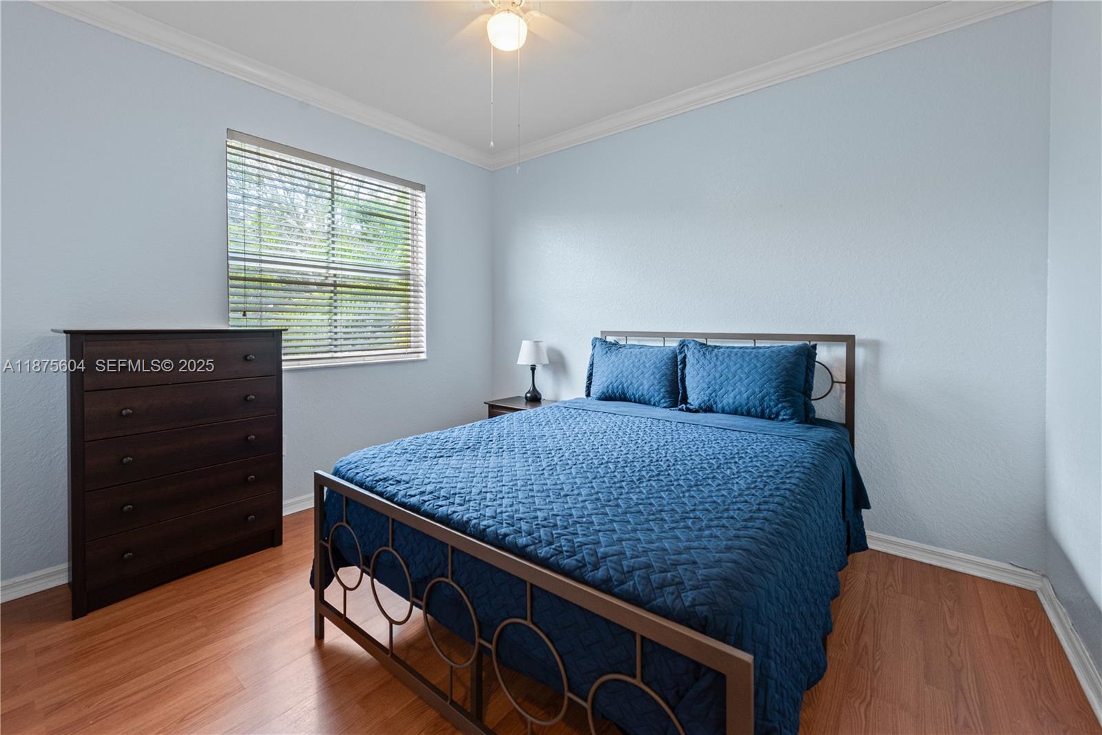1316 Southeast 18th Terrace Homestead, FL 33035 - Photo 15 of 29 a bedroom with a bed and a dresser