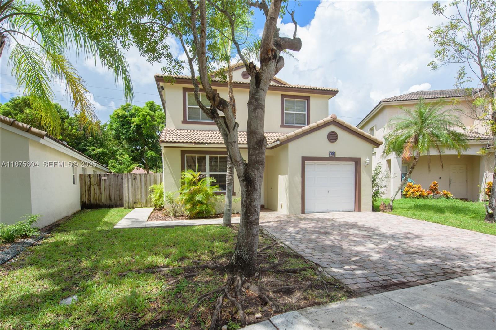 1316 Southeast 18th Terrace Homestead, FL 33035 - Photo 23 of 29 a front view of a house with a yard and garage