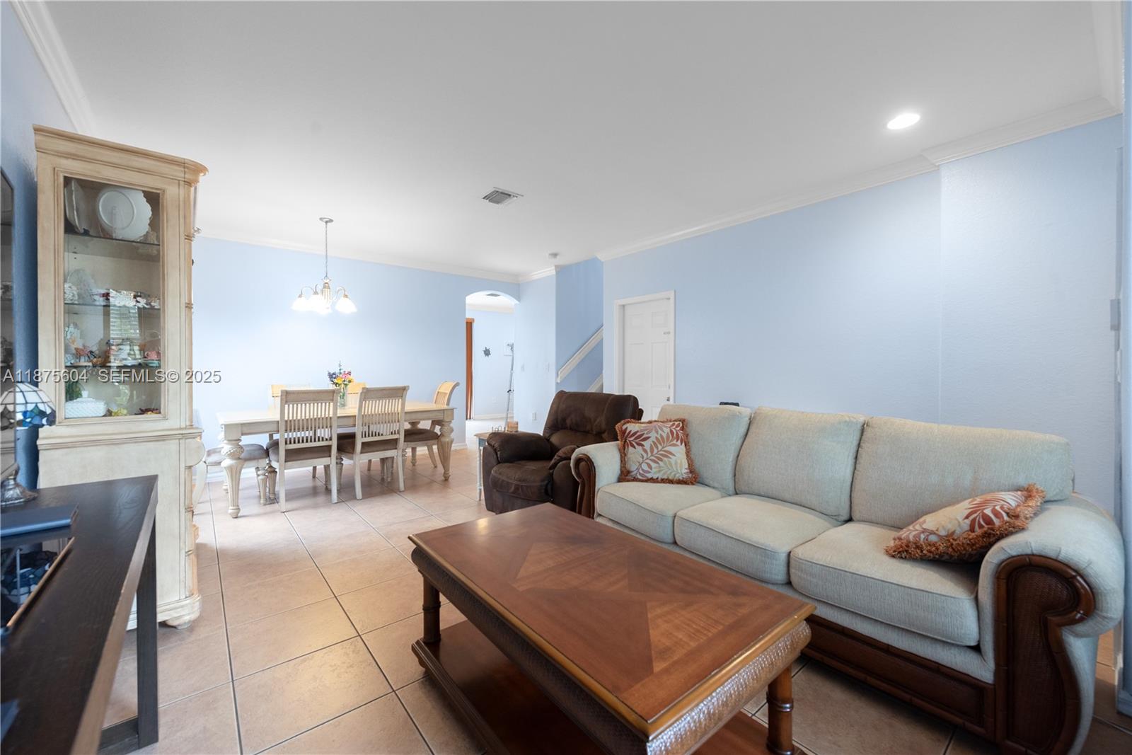 1316 Southeast 18th Terrace Homestead, FL 33035 - Photo 3 of 29 a living room with furniture and a table