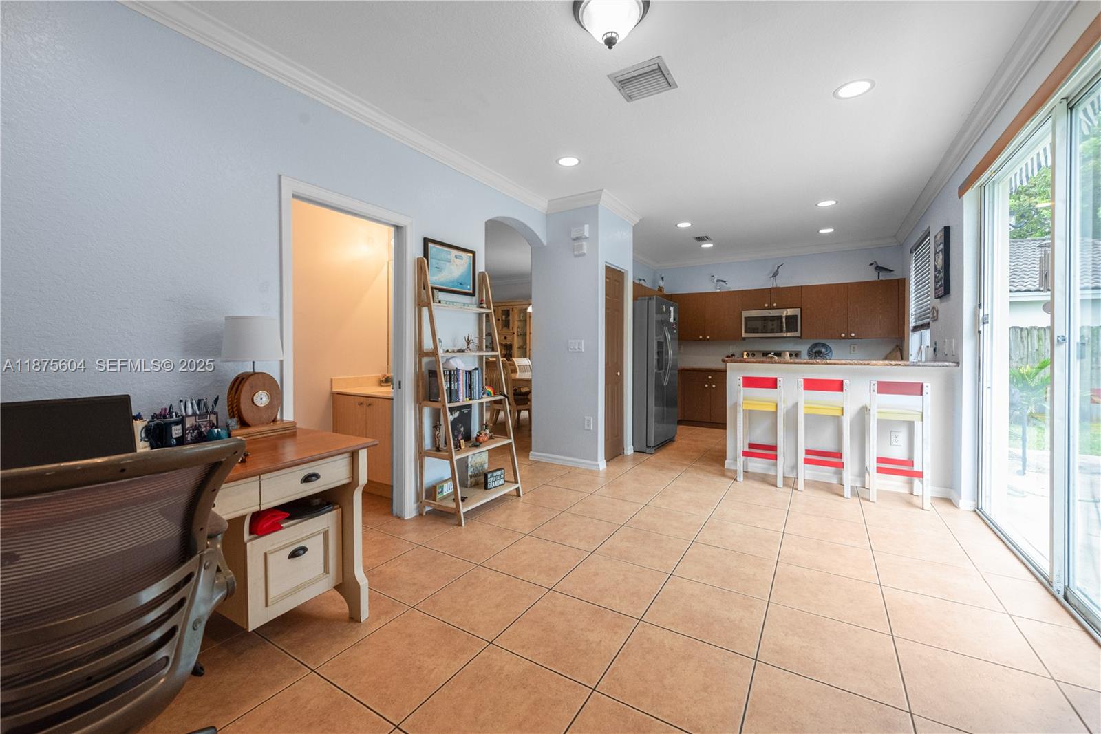 1316 Southeast 18th Terrace Homestead, FL 33035 - Photo 4 of 29 a room with furniture a air conditioner and a window