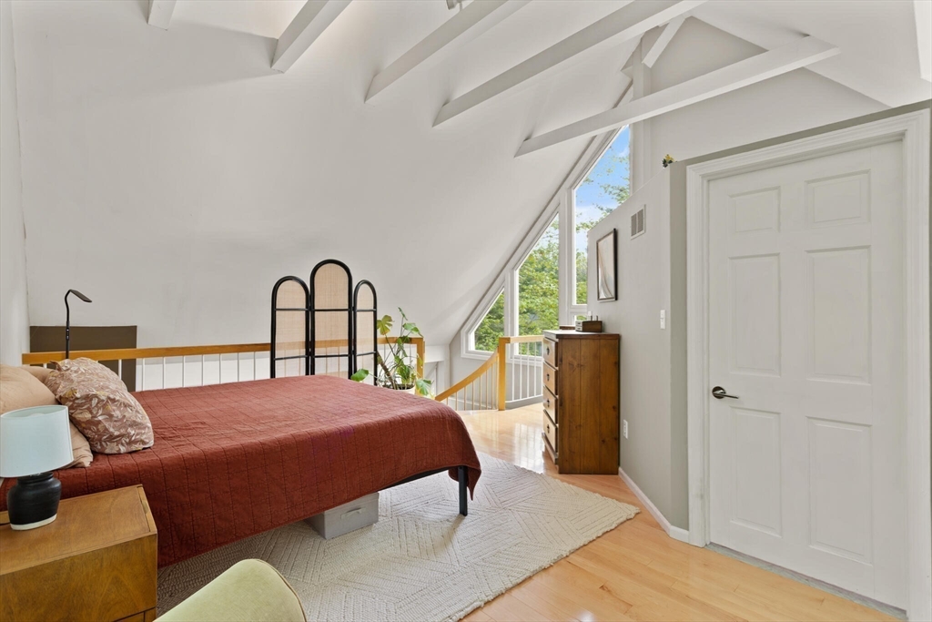 111 Brigham Street, Unit 4D Hudson, MA 01749 - Photo 18 of 39 a bedroom with a bed and a large window