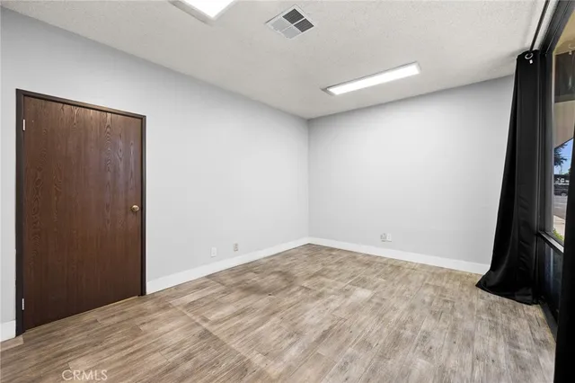 a view of cabinets and wooden floor