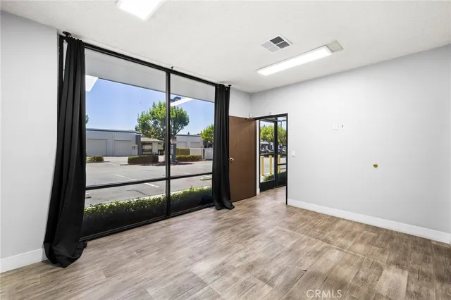 a bathroom with a granite countertop toilet and a sink