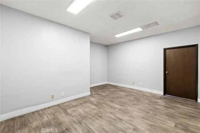 a view of a room with wooden walls