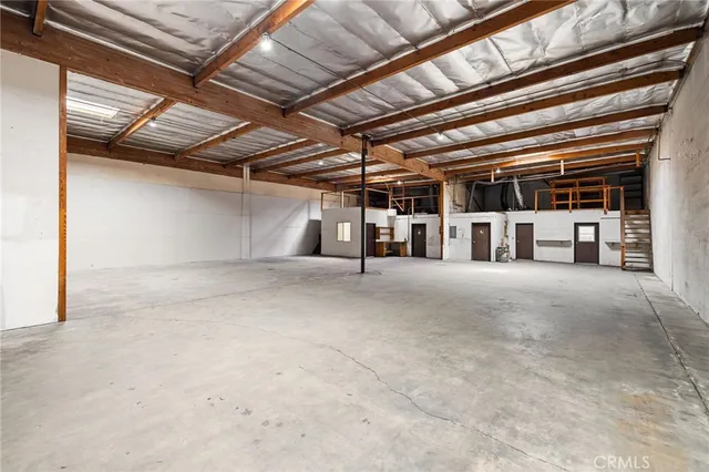 a view of a big house with a mountain in the background