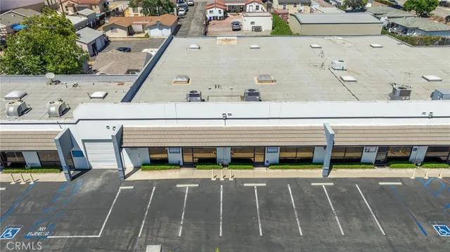a kitchen with refrigerator cabinets and wooden floor