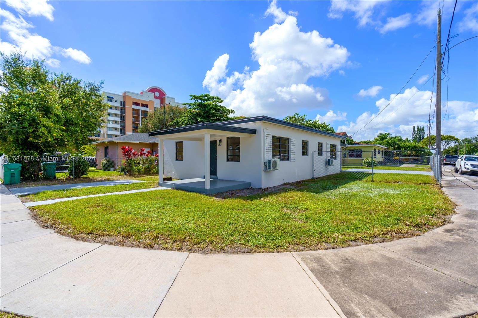1400 Northwest 55th Street Miami, FL 33142 - Photo 1 of 33 a view of a house with a backyard