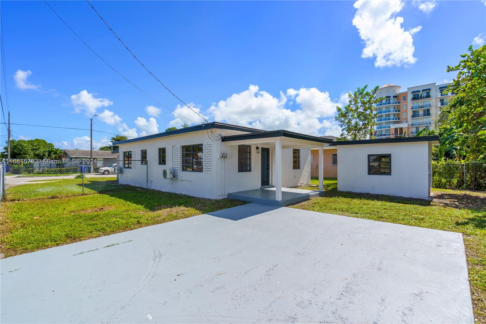 1400 Northwest 55th Street Miami, FL 33142 - Photo 14 of 33 a view of a house with backyard and sitting area