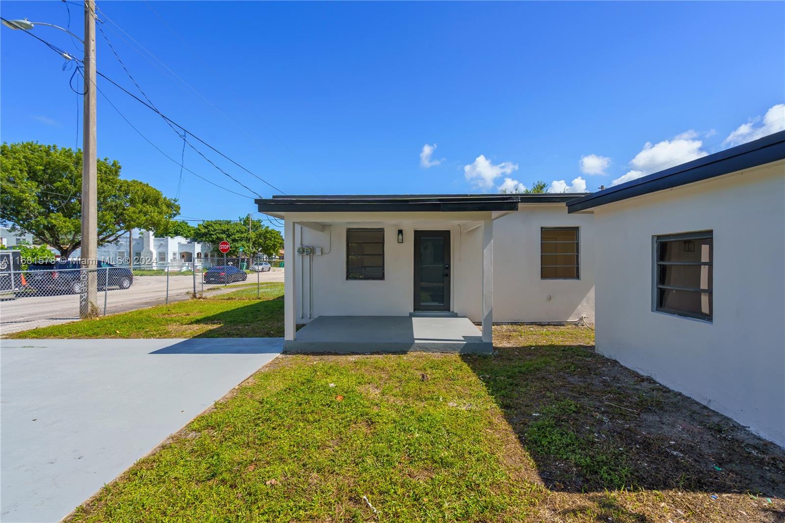 1400 Northwest 55th Street Miami, FL 33142 - Photo 16 of 33 a view of a house with swimming pool and yard