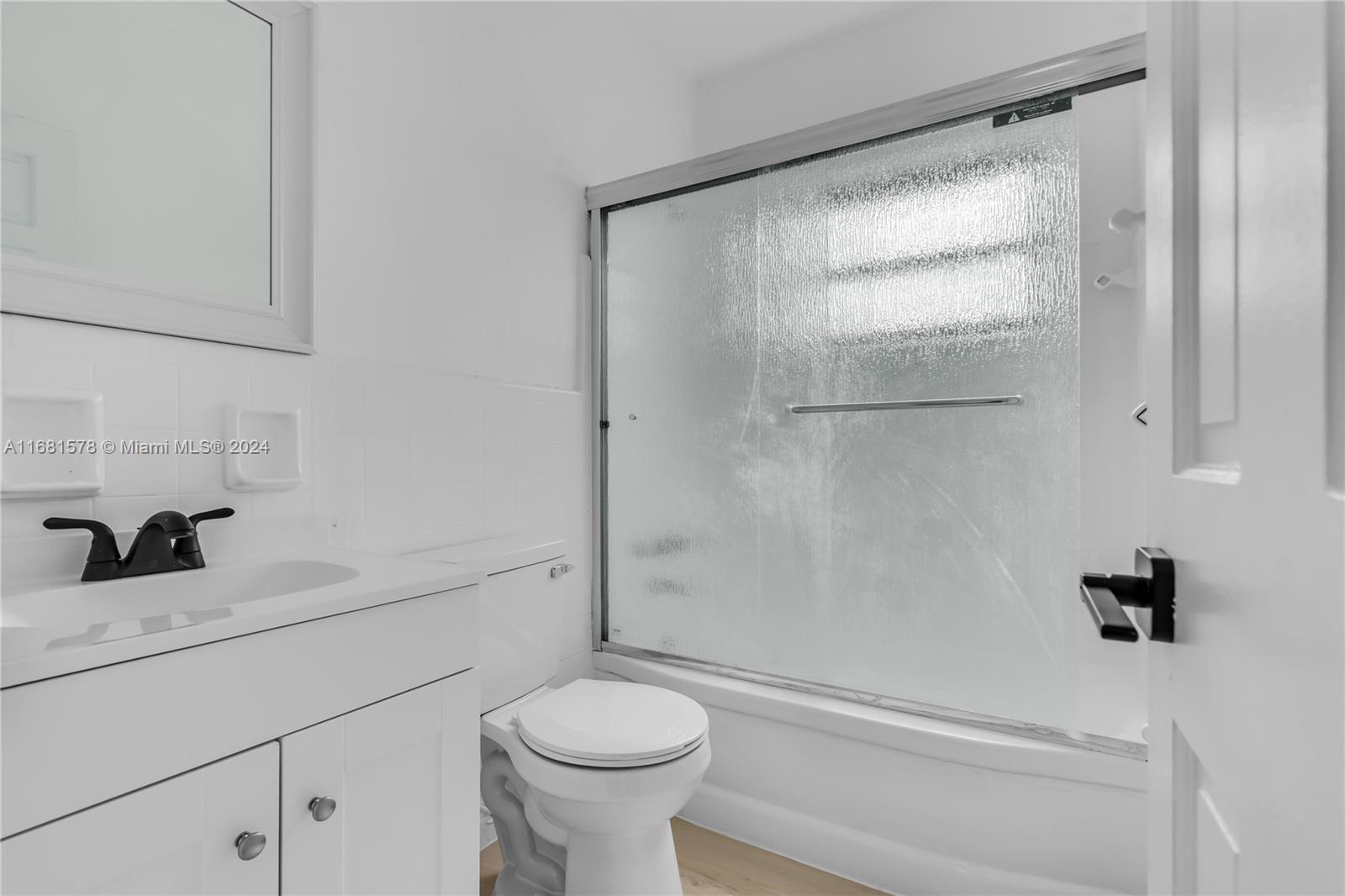1400 Northwest 55th Street Miami, FL 33142 - Photo 27 of 33 a bathroom with a sink and a vanity