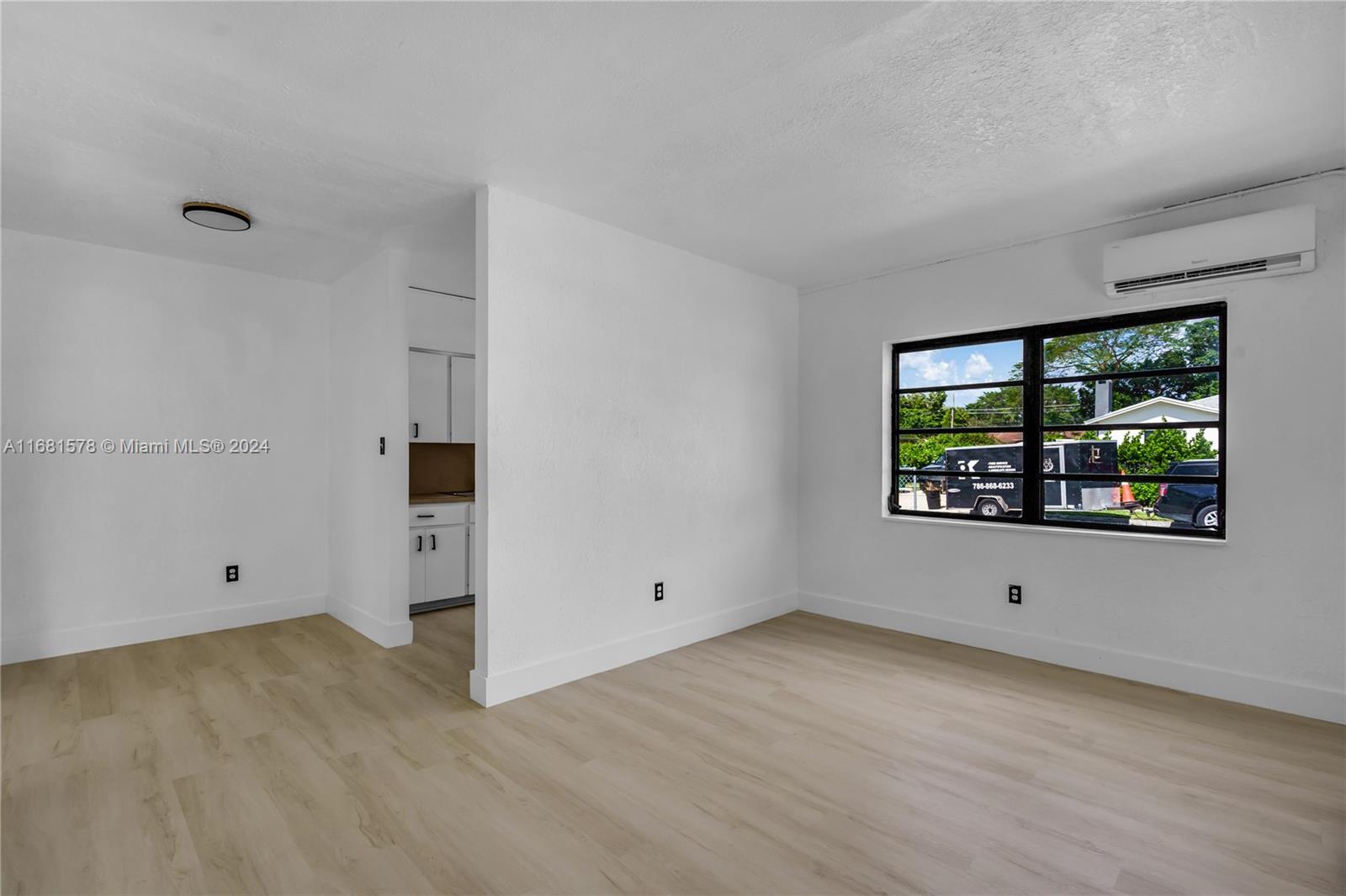 1400 Northwest 55th Street Miami, FL 33142 - Photo 4 of 33 wooden floor in an empty room