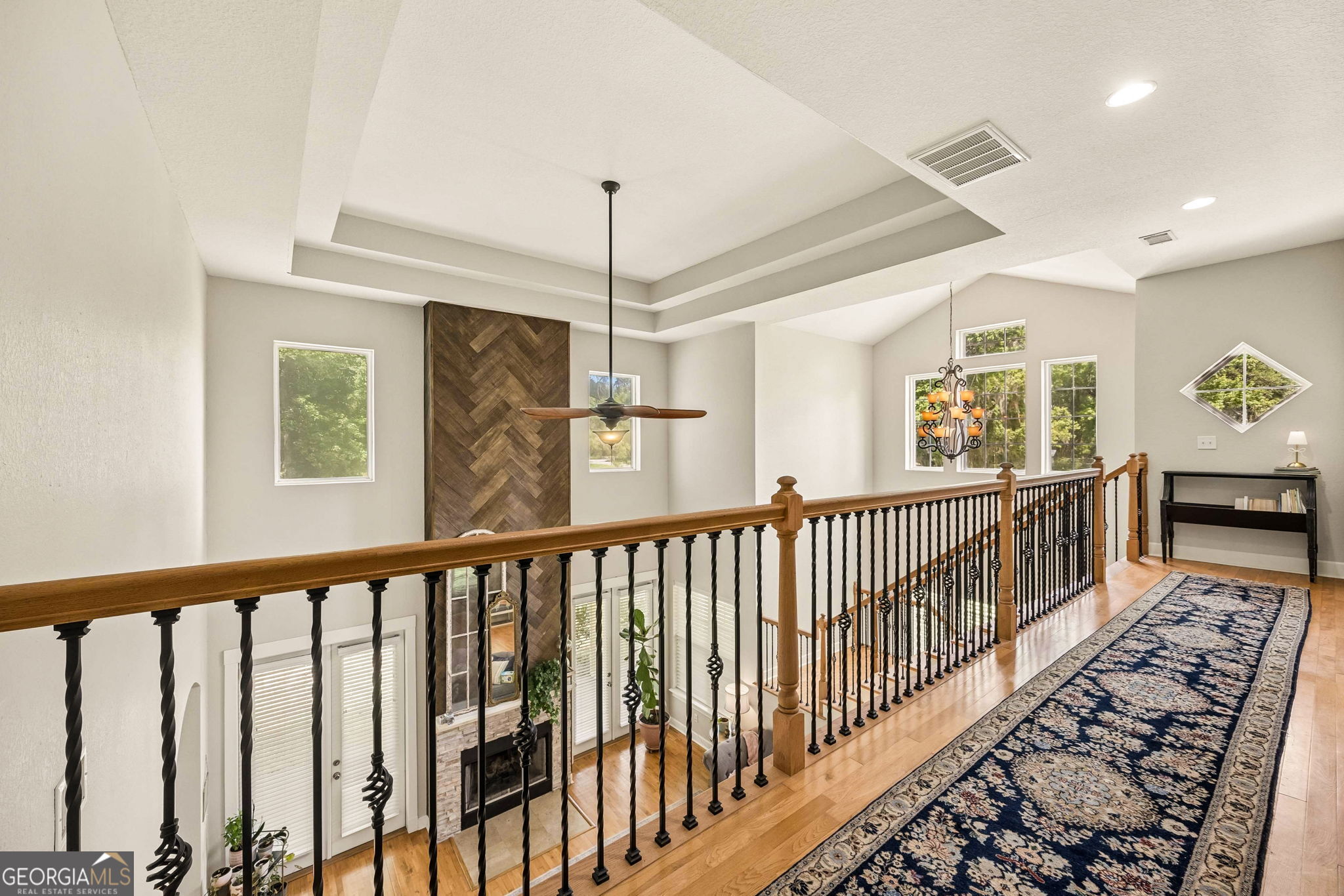 706 Hopewell Point Road White Oak, GA 31568 - Photo 39 of 84 The spacious upstairs gallery overlooks the soaring great room below, enhancing the home's open and airy design while providing access to secondary bedrooms and living spaces.
