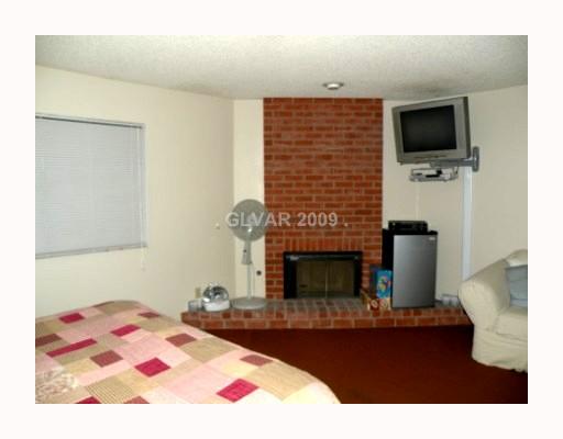 5518 West Viking Road Las Vegas, NV 89103 - Photo 8 of 12 Master Bedroom. Fireplace in master bedroom. Support for TV may not stay.