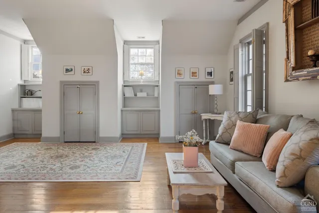 a living room with furniture and a rug