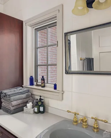 a view of a swimming pool with a patio and a yard