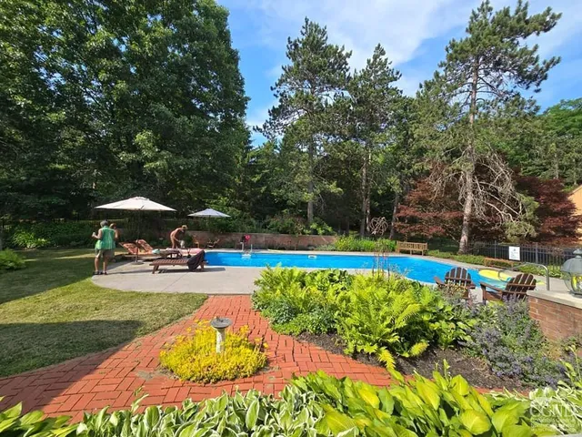 a view of a garden with sitting area