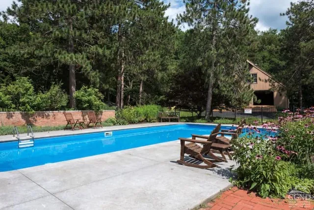 a front view of a house with outdoor seating
