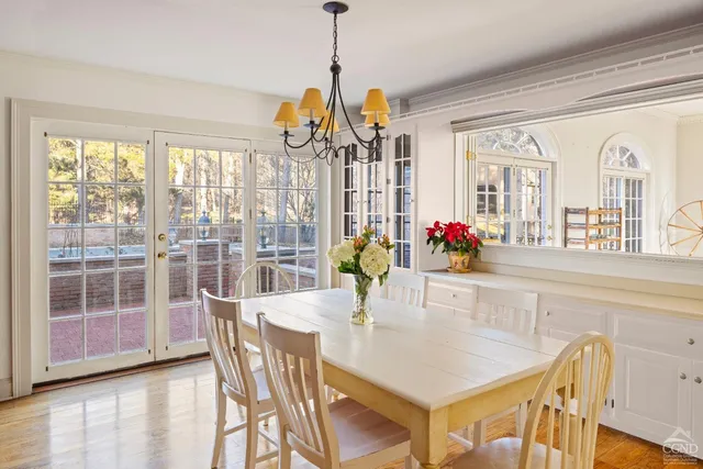 a view of a dining room with furniture wooden floor and livingroom