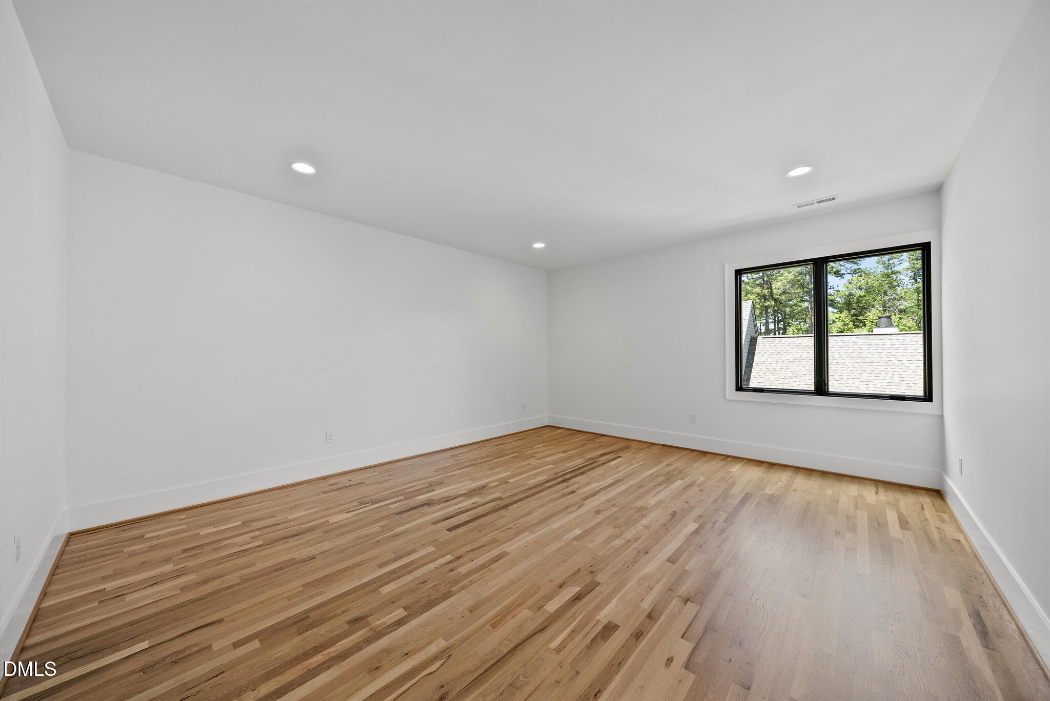 1609 Ridge Road Raleigh, NC 27607 - Photo 38 of 62 wooden floor in an empty room with a window