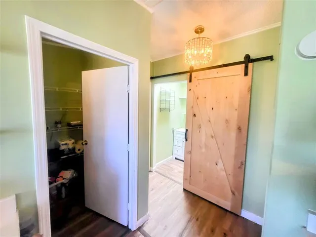a bathroom with a glass shower door