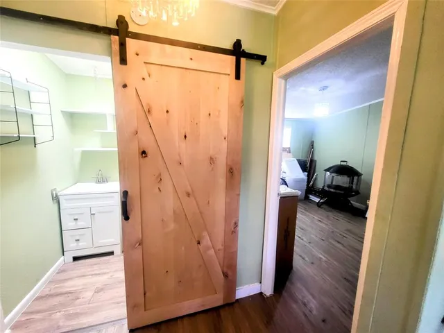 a view of a bathroom from a hallway