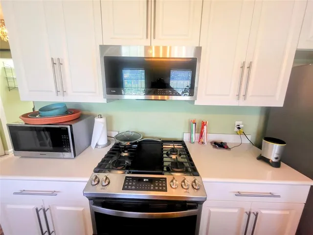 a kitchen with a stove and a sink