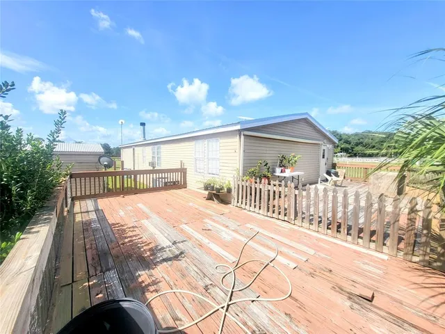 a view of a backyard with sitting area