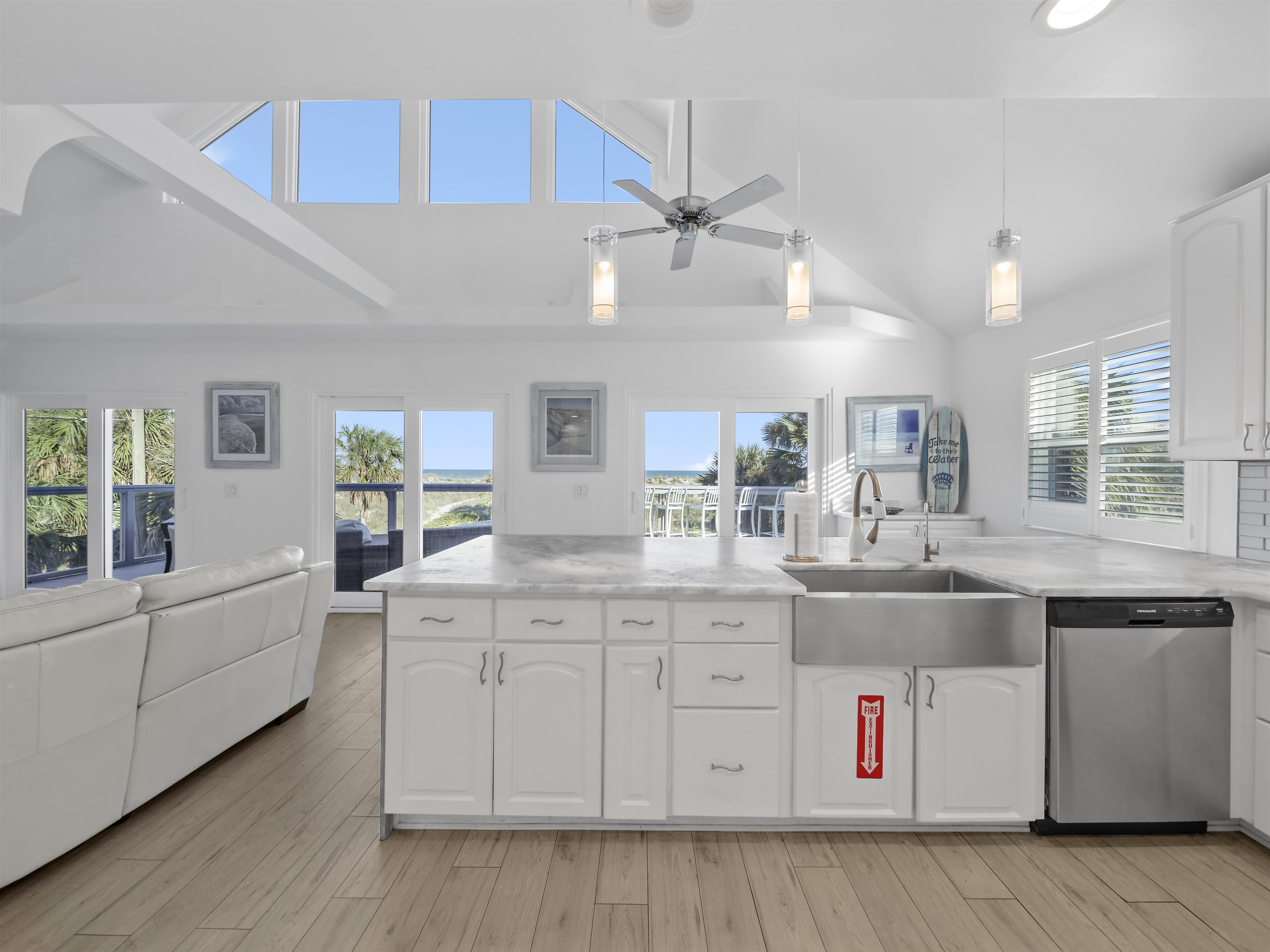1 E Street St. Augustine, FL 32080 - Photo 16 of 54 a kitchen with granite countertop a sink a counter space appliances and cabinets