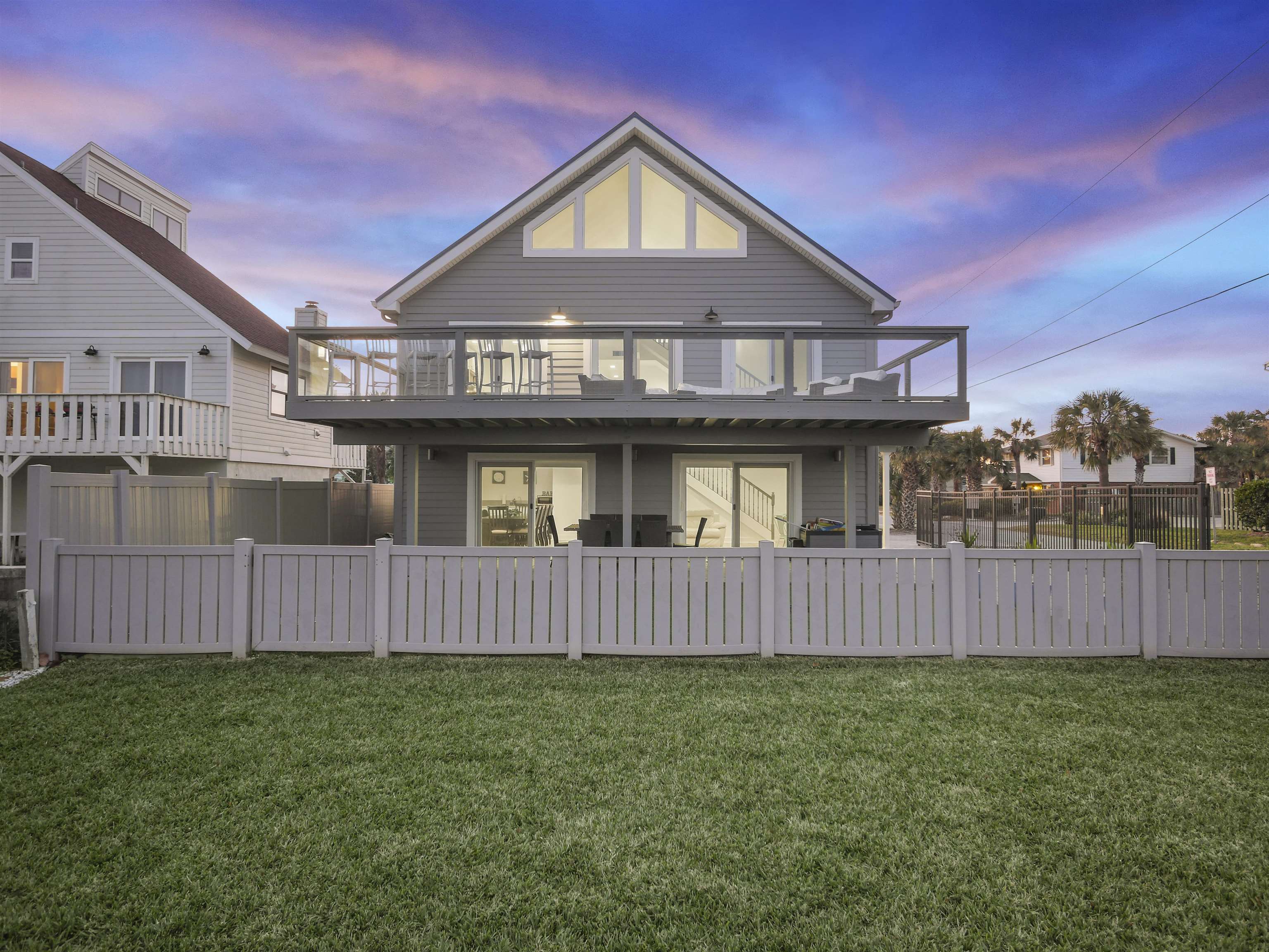 1 E Street St. Augustine, FL 32080 - Photo 46 of 54 a view of a house with a yard and wooden fence