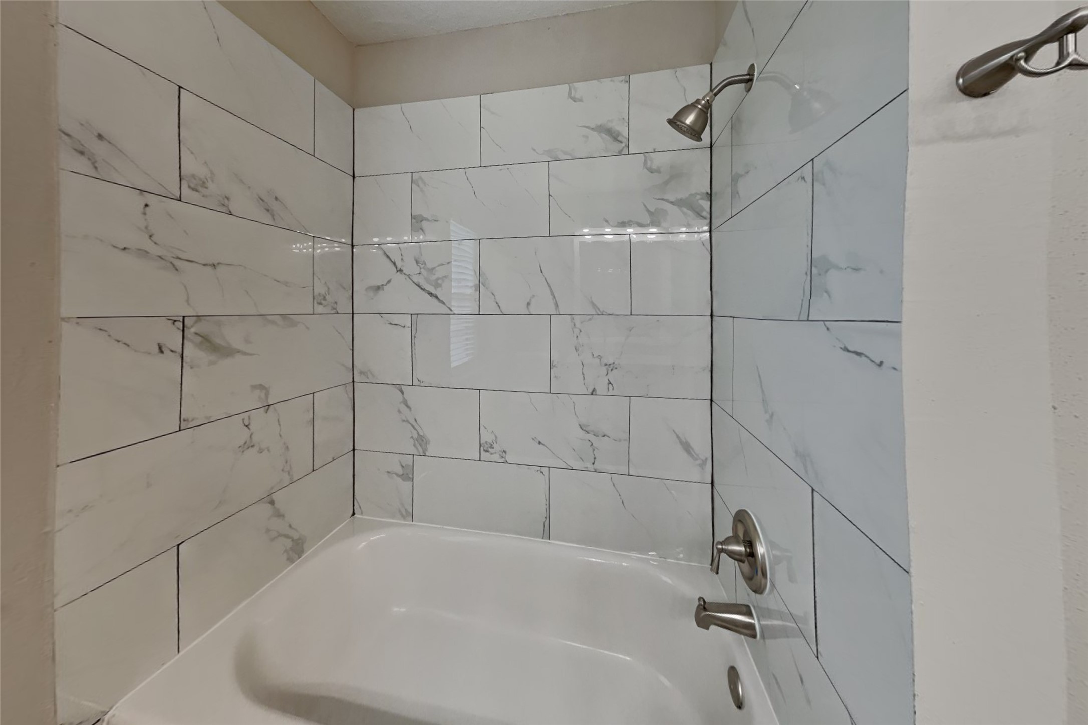 16303 Hickory Point Road Houston, TX 77095 - Photo 18 of 21 a bathroom with a bathtub