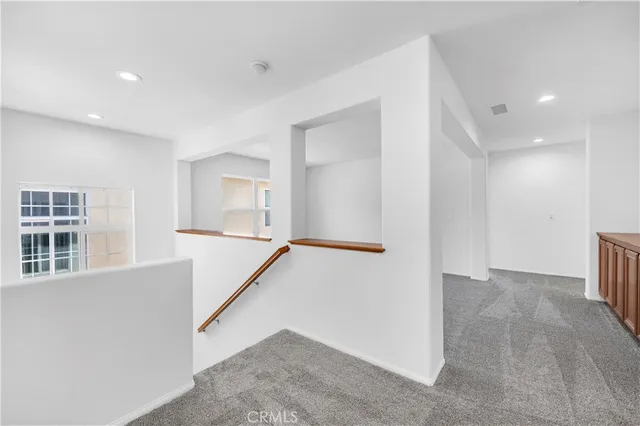 a view of a big room with windows