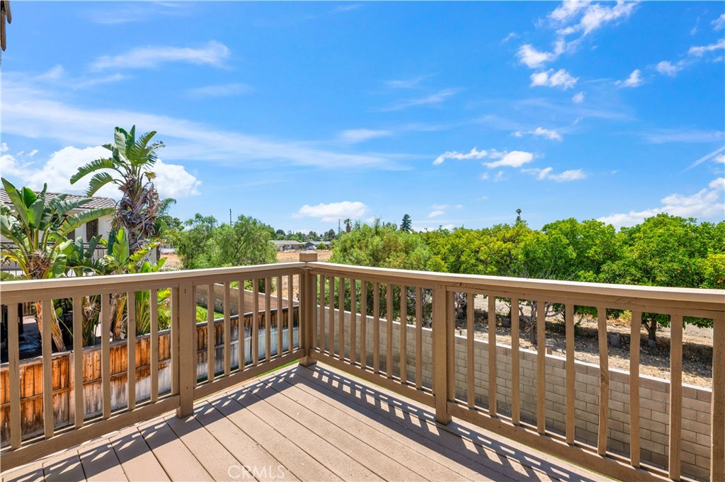 1984 Bronte Road San Jacinto, CA 92583 - Photo 18 of 30 a balcony with wooden floor and fence