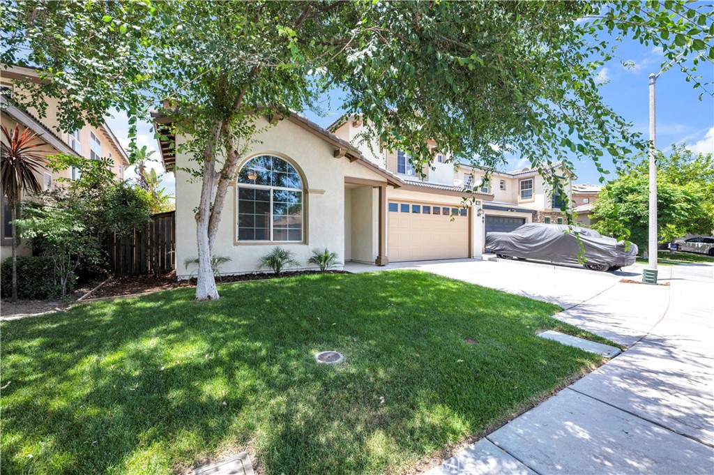1984 Bronte Road San Jacinto, CA 92583 - Photo 3 of 30 a front view of a house with a yard and garage