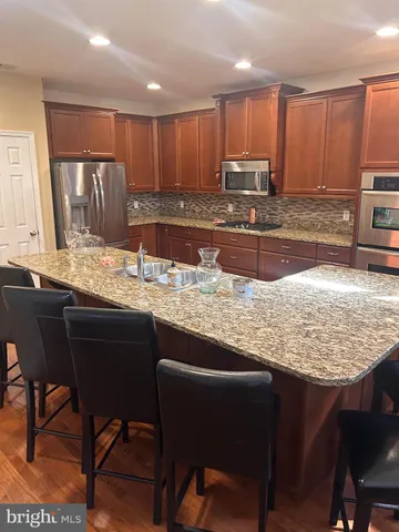 a kitchen with a large window in it and kitchen view