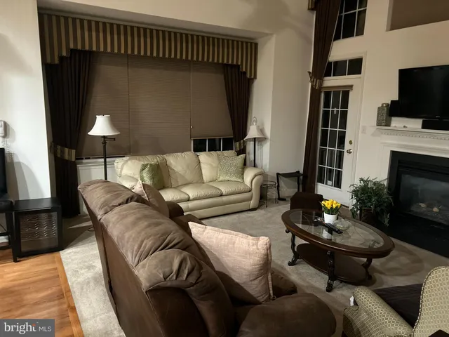 a bedroom with a bed lamp and a window